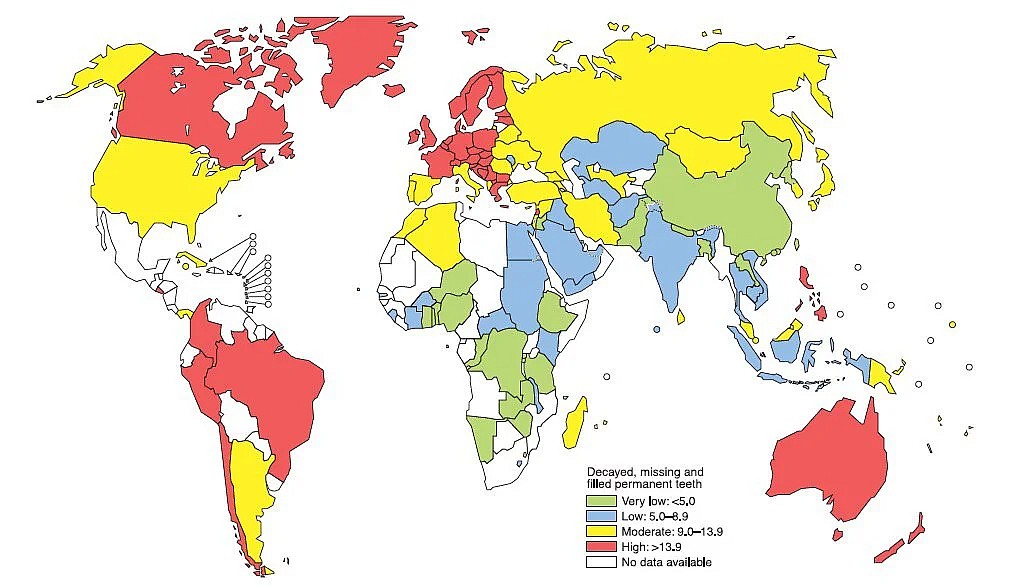 Występowanie ubytków w zębach według kraju.